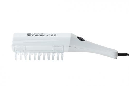Dermalight handheld phototherapy device side view with comb